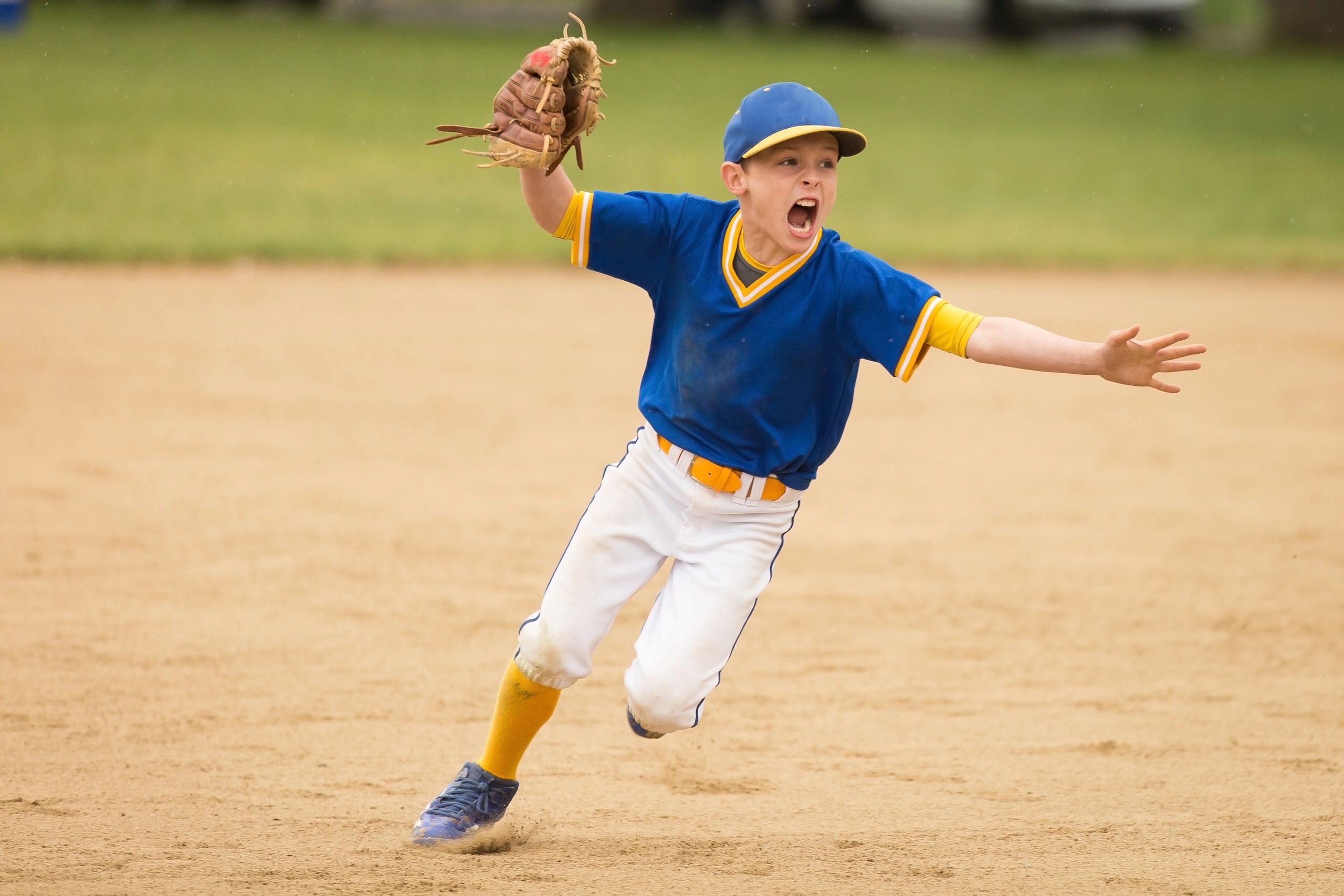 Young baseball player catching
